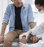 doctor-performing-routine-medical-checkup