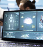 Cardiology experts team examine electrocardiogram test results and scans to develop effective treatment plan against a condition. Medical staff review analytics and hospital records. Close up.
