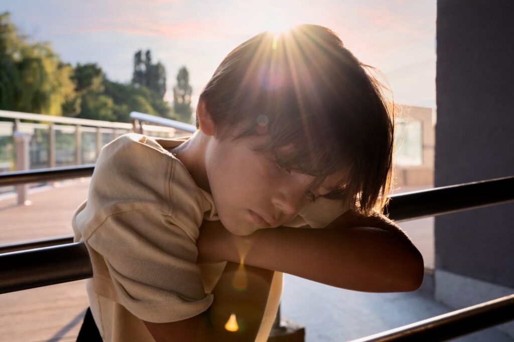 Child staying hydrated and cool to prevent heat exhaustion during summer