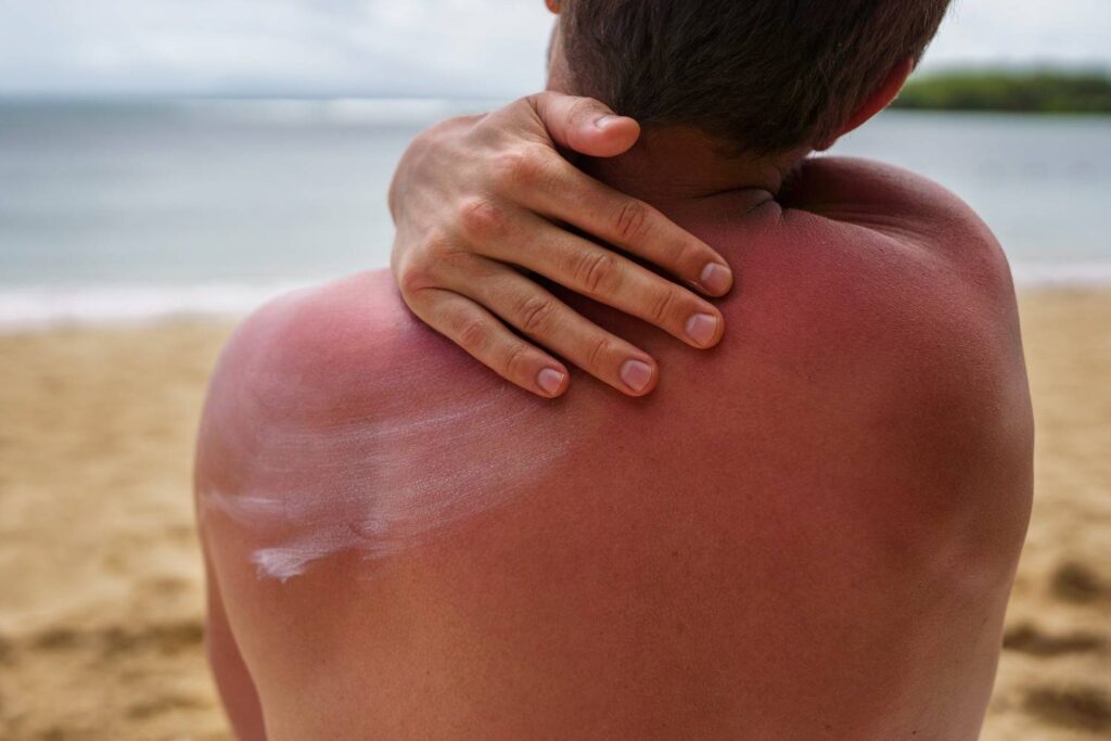 Dermatologist examining skin for signs of UV damage and skin changes