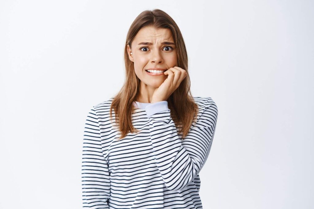 Young woman receiving a dental examination for early tooth loss concerns.
